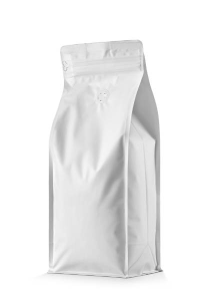 Blank white aluminum foil pouch bag with valve for coffee packaging isolated on white.
