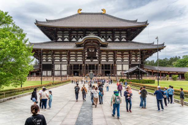 Nara, Japan - 05.06.2024: Group of tourists visiting Todai-ji Buddhist temple complex in Nara