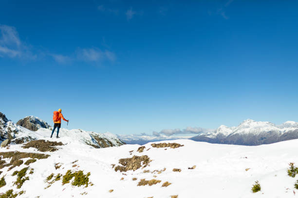 Mid adult man hiking in winter mountain alone