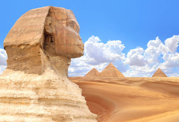 istock Famous Great Sphinx and pyramids of Chephren, Cheops, Menkaure, Cairo, Egypt. Great Pyramids and statue of Sphinx, mythical creature with head of man and body of lion, Giza complex (Giza Necropolis) 2184599043