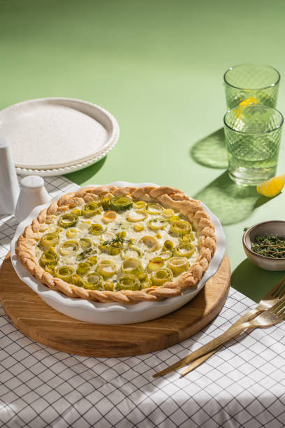 Quiche open tart pie with leek and chicken meat. Savory taste.