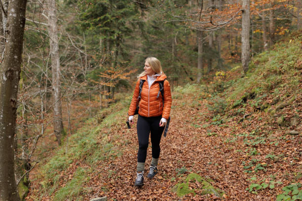 istock Woman Enjoying a Peaceful Hike Through the Forest 2184601899