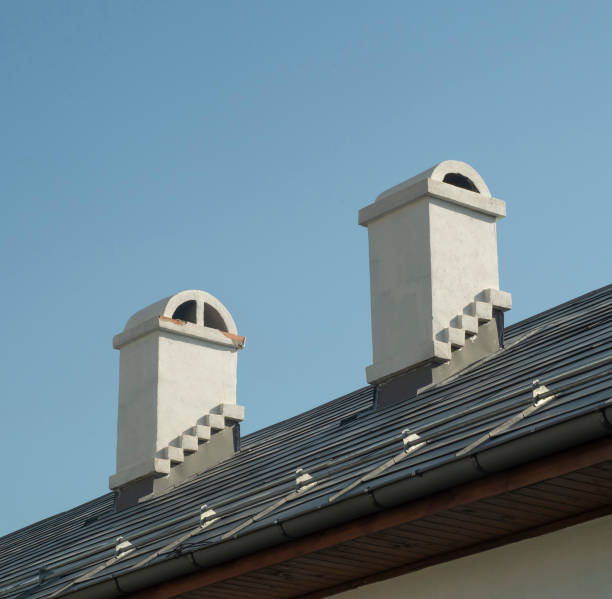 istock New tin roof with 2 white chimneys 2184601926