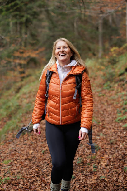 istock Woman Enjoying a Peaceful Hike Through the Forest 2184601950