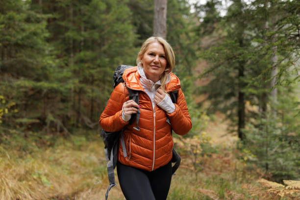 istock Woman Enjoying a Peaceful Hike Through the Forest 2184602090