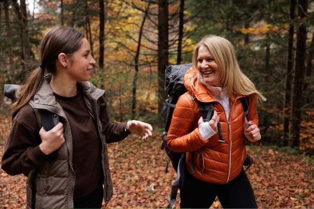 istock Two Women Enjoying a Scenic Hike Through Autumn Forest 2184602094