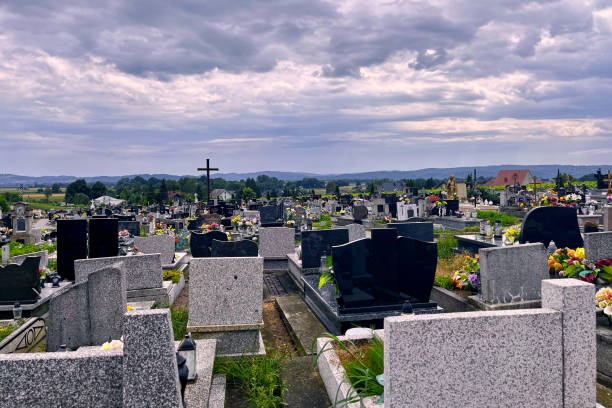 Krakow, Poland - July 28, 2024 : View of a cemetery grave yard in green nature surrounding