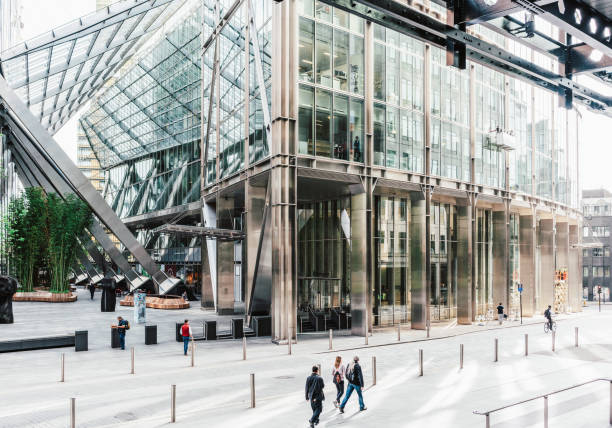 London, UK - Pedestrians passing modern City of London offices by Liverpool Street train station.