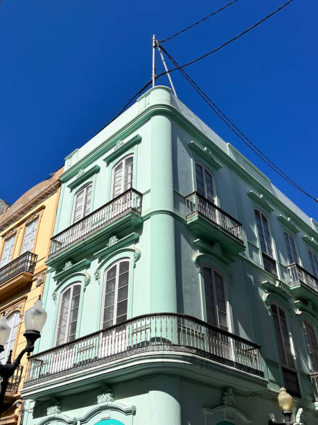 istock Colorful closeup ancient typical colonial style building with iron balcony in main square against blue sky in Las Palmas de Gran Canaria, Canary Island, Spain. 2184607444