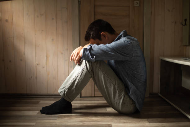 istock Lonely men sitting in the room. 2184609264