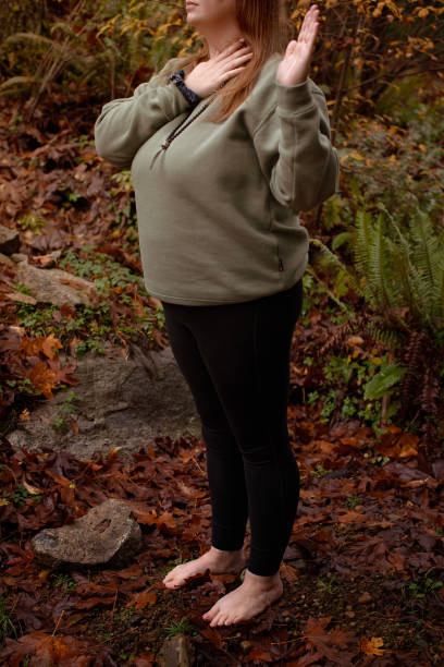 istock Woman grounding herself in nature 2184609715