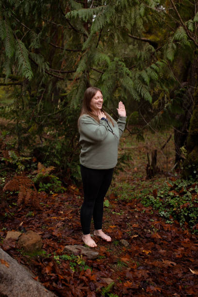 istock Woman grounding herself in nature 2184609720