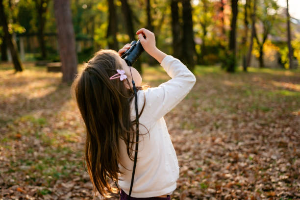 istock Girl with binoculars in nature 2184612875