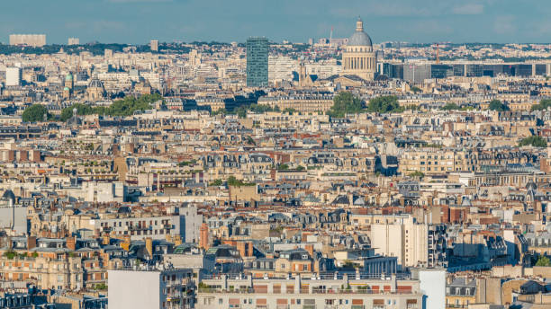istock Aerial panorama above many houses rooftops in a Paris timelapse 2184613144