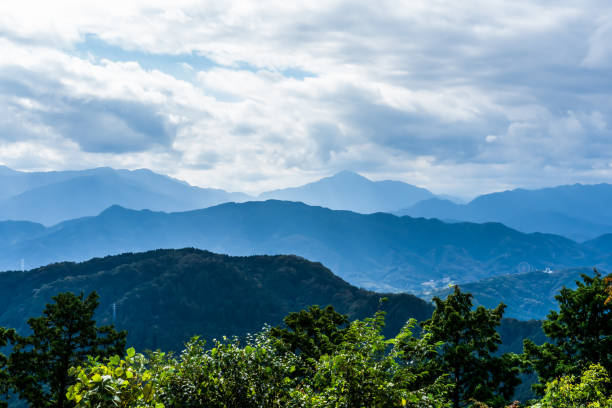 istock Serene Mountain Layers under Clouded Sky in Japan 2184613462