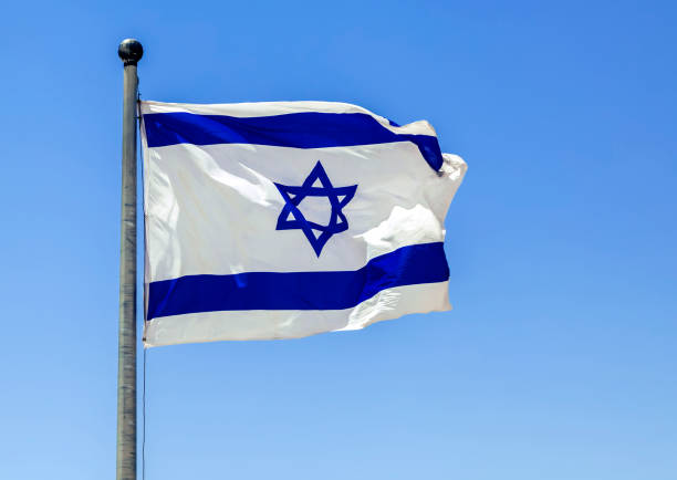 istock The Israeli flag waving in the bright sunlight 2184614164