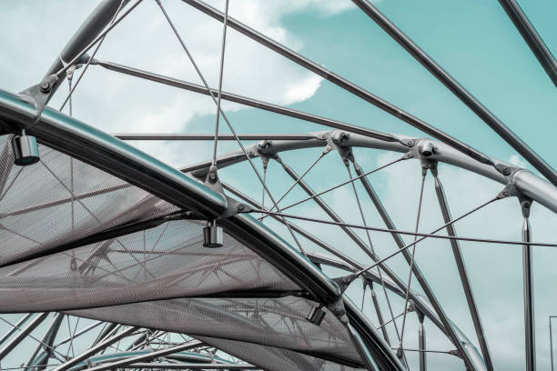 istock Metal structures with mesh and cables under a blue sky, forming an abstract modern architectural design 2184618214
