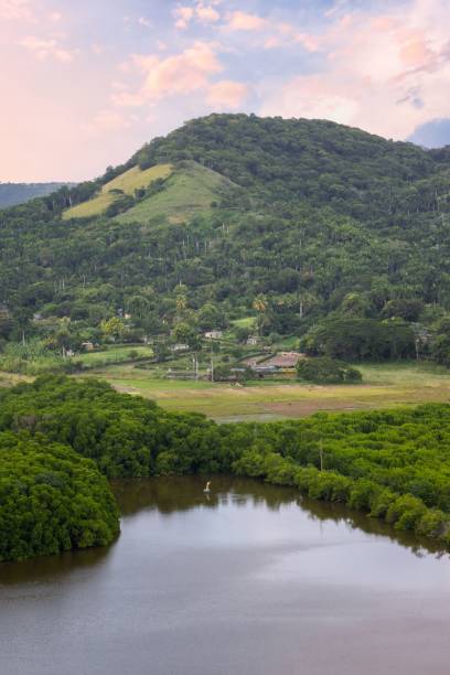 istock Lush Green Hill and Tranquil Lake 2184620288