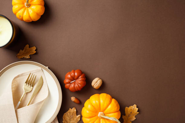 istock Autumn table setting with pumpkins, walnuts, and dry oak leaves. Perfect for fall, Thanksgiving, and seasonal content 2184620991