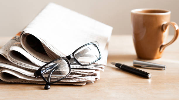 istock Pile of newspapers stacks on table 2184622471