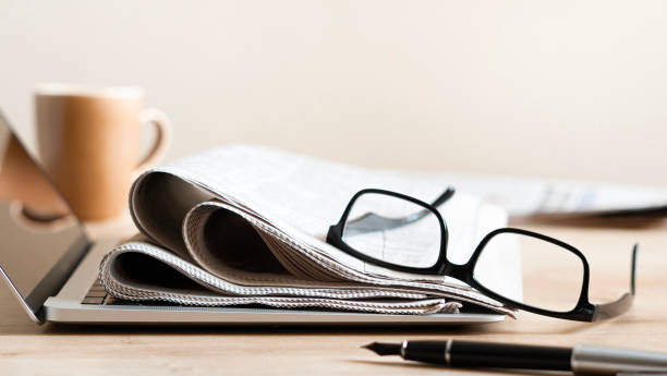 istock Pile of newspapers stacks on table 2184622511