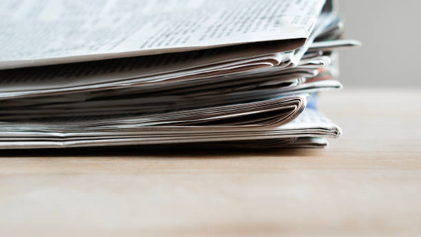 istock Pile of newspapers stacks on table 2184622600