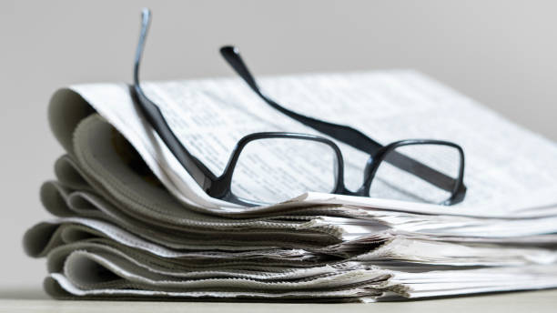istock Pile of newspapers stacks on table 2184622601