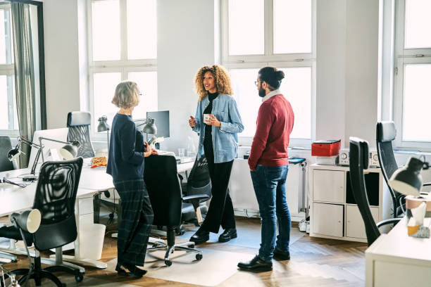 istock Business team in office having discussion during coffee break 2184628276