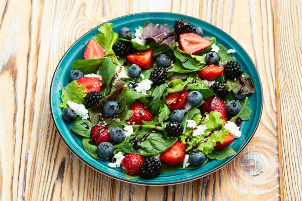 istock Berries salad (blueberry strawberry blackberry ) with cheese feta and balsamic sauce 2184629802