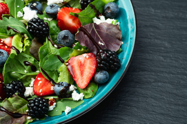 istock Berries salad (blueberry strawberry blackberry ) with cheese feta and balsamic sauce 2184629820