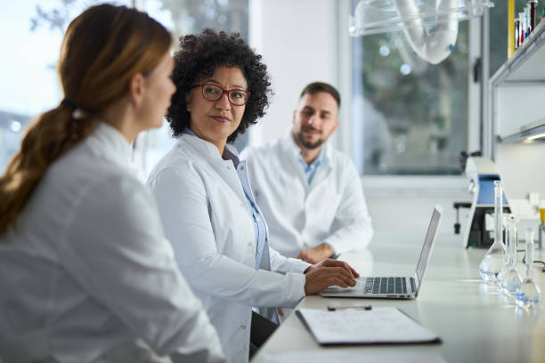 istock Group of scientists working together in laboratory 2184632685
