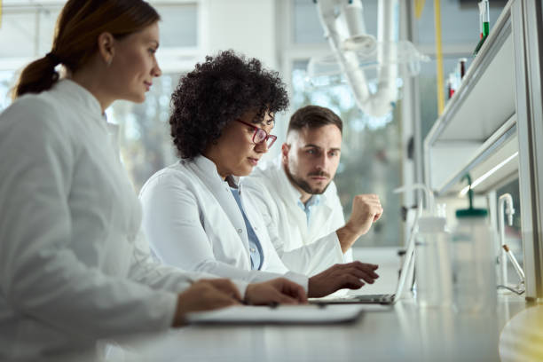 istock Group of scientists working together in laboratory 2184633001