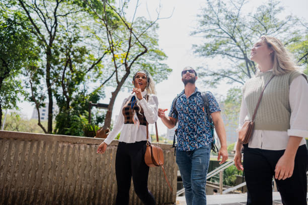 istock Tour guide explaining to couple in the city 2184633296
