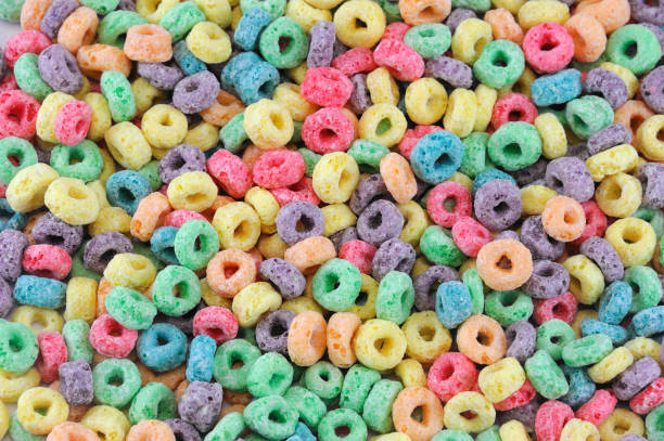 istock Colorful cereal loop rings, breakfast food background 2184633341
