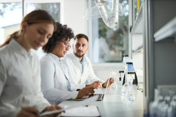 istock Group of scientists working together in laboratory 2184633354
