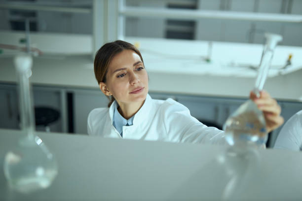 istock Female scientist examining chemicals in laboratory 2184633423