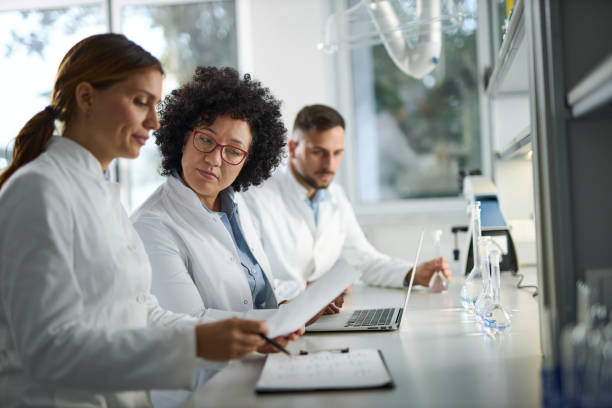 istock Team of scientist discussing over the experiment results. 2184633533