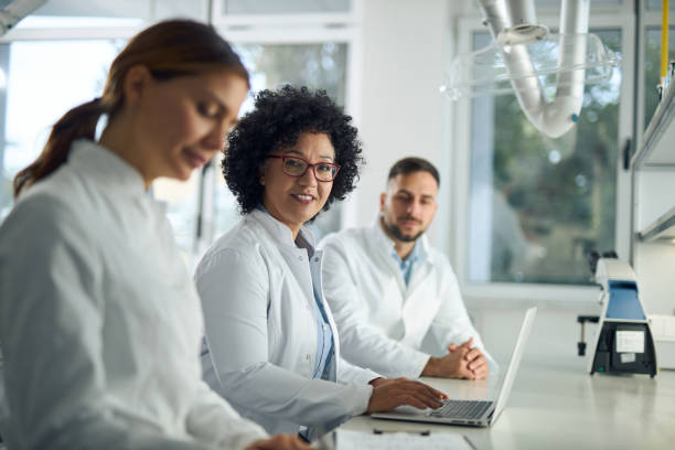 istock Group of scientists working together in laboratory 2184633586