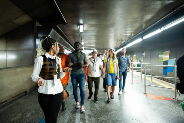 istock Tour guide walking while explaining to tourists in the subway station 2184634090
