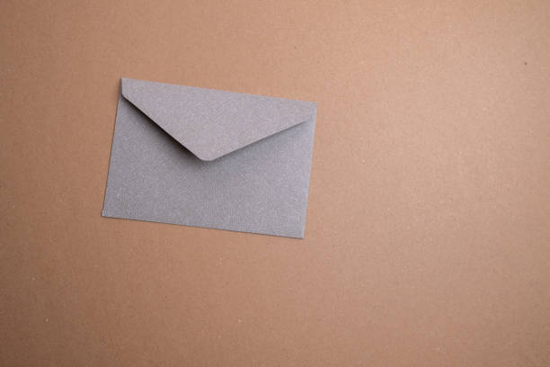 istock Paper envelopes on a light background. New mail, write a message. Send and receive mail. Postal delivery service. Empty envelope, empty space. Communication with people, paperwork. Envelope close-up 2184634601