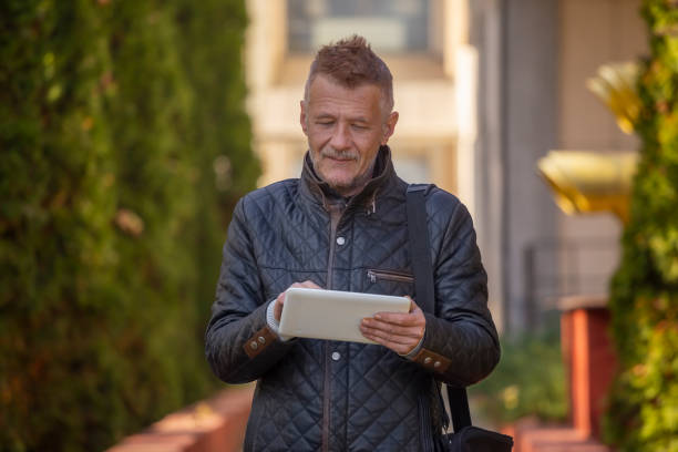 istock Man Using digital tablet In Outdoor Urban Environments 2184634925