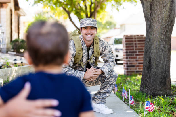 istock Soldier smiles at toddler son upon return home from deployment 2184635657