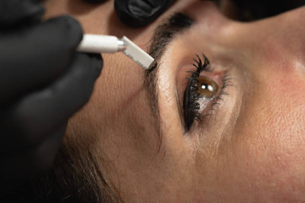 istock close-up, eyebrow tattoos open eyes 2184639014