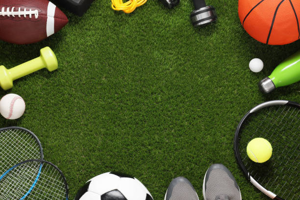 istock Frame of different sport tools on green grass, flat lay. Space for text 2184640573