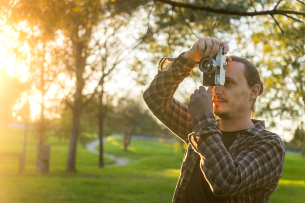 istock Photographer shooting analog film camera 2184643115