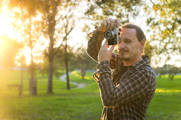 istock Photographer shooting analog film camera 2184643144