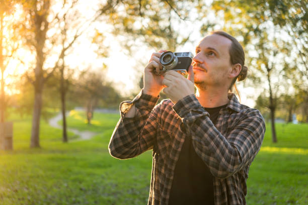 istock Photographer shooting analog film camera 2184643147