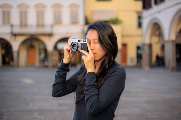 istock Photographer shooting analog film camera 2184643155