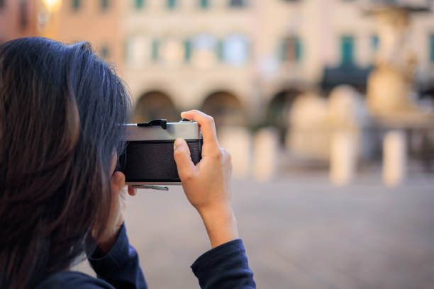 Girl with vintage analog camera. Copy space.