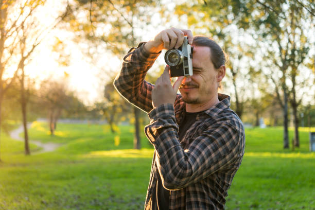 istock Photographer shooting analog film camera 2184643170